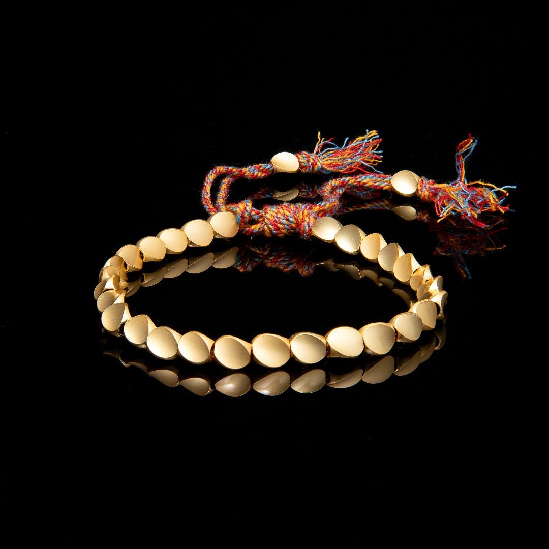 The braided copper band, darkened